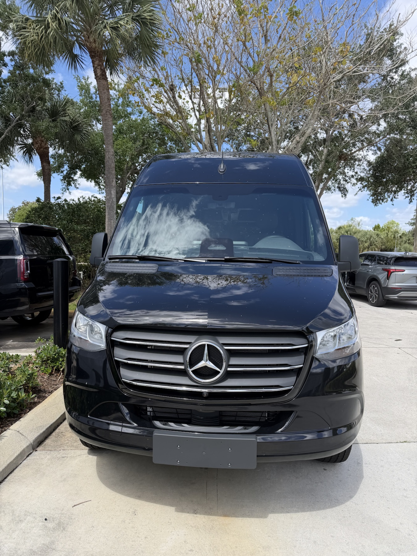 Front view of the black Mercedes-Benz Sprinter van