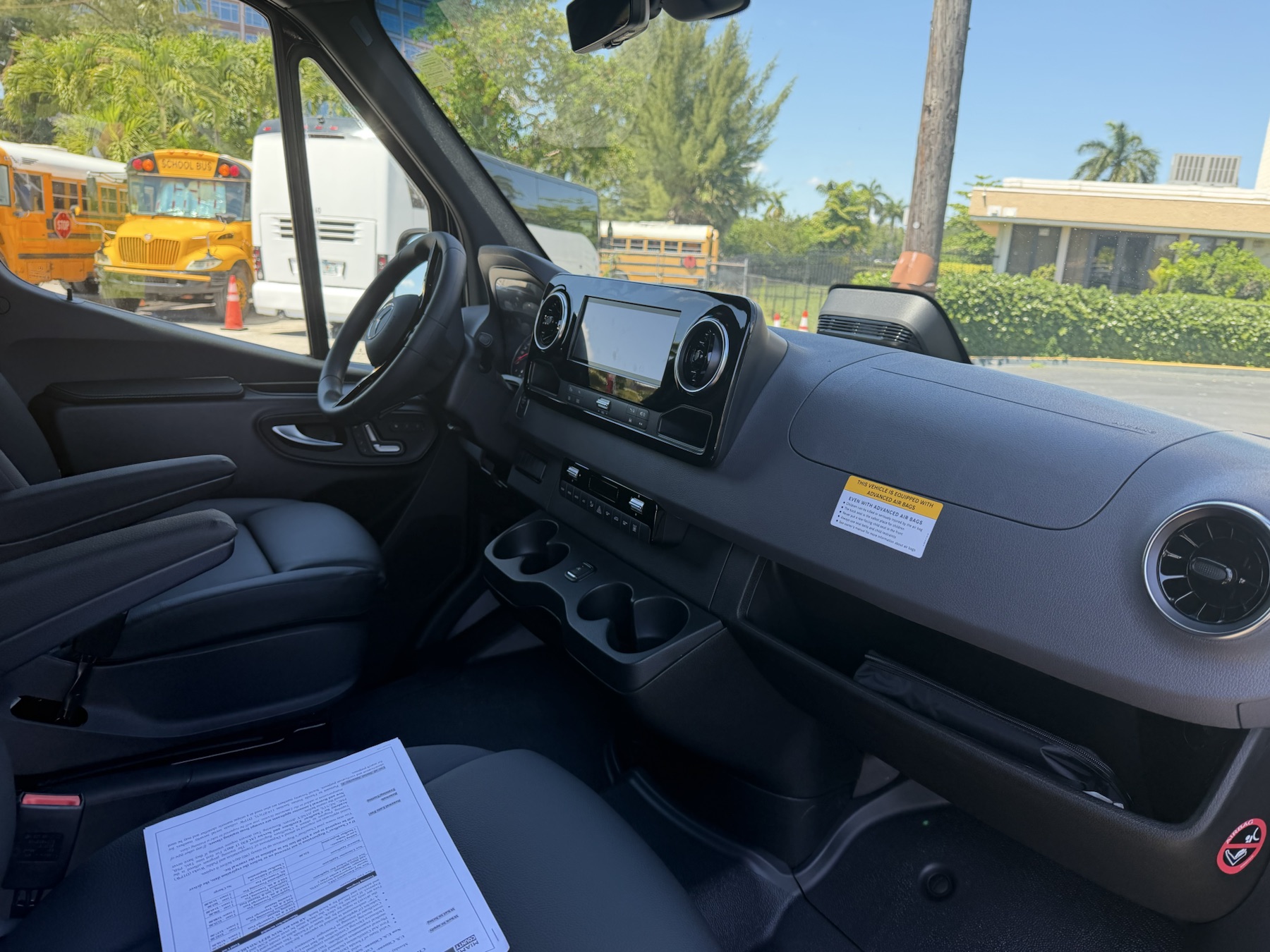 Side angle of the black Mercedes-Benz Sprinter van